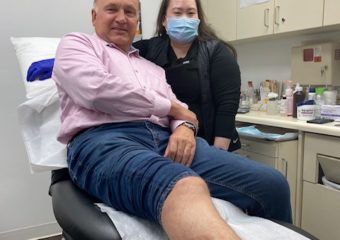 man with melanoma surgical incision on leg
