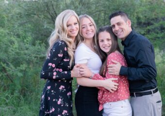 Katie with her family in 2019, after she was declared five years cancer free.