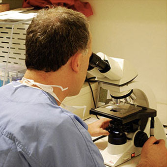 julie-6 mohs surgeon examining tumor